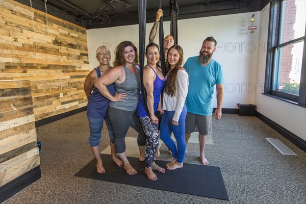 People posing with hanging silks