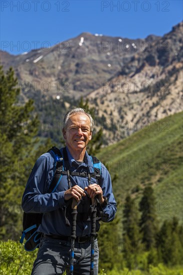 Caucasian man hiking in mountains