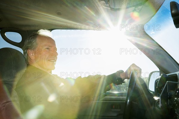Caucasian man driving car