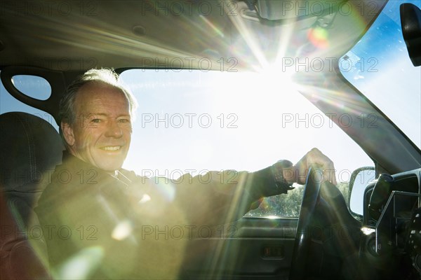 Caucasian man driving car