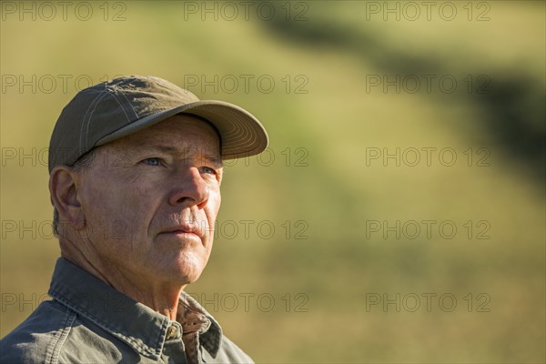 Pensive Caucasian farmer