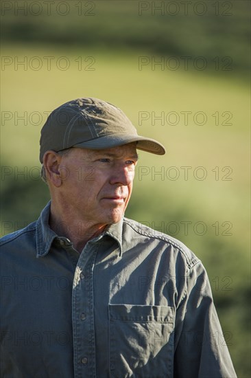 Caucasian farmer standing in field