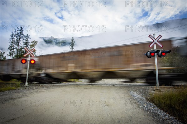 Train speeding through railroad crossing