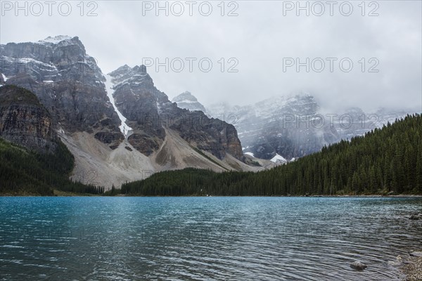 Lake at foggy mountain