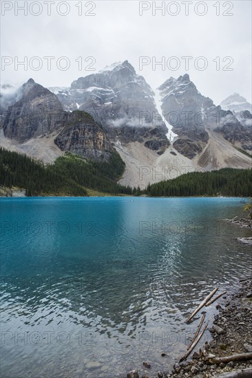 Lake at foggy mountain