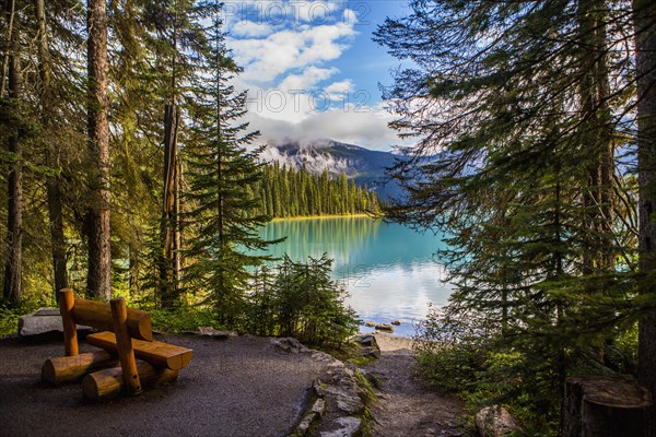 Wooden bench at mountain lake