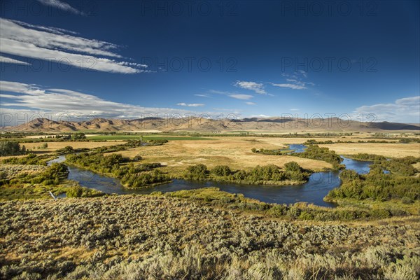 Winding river near mountain range