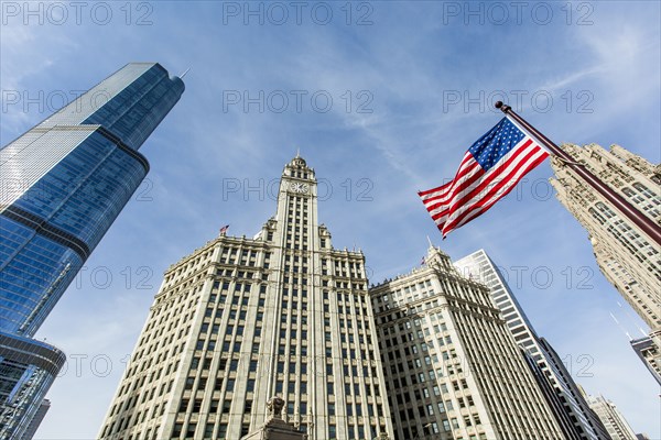 American flag and highrise buildings