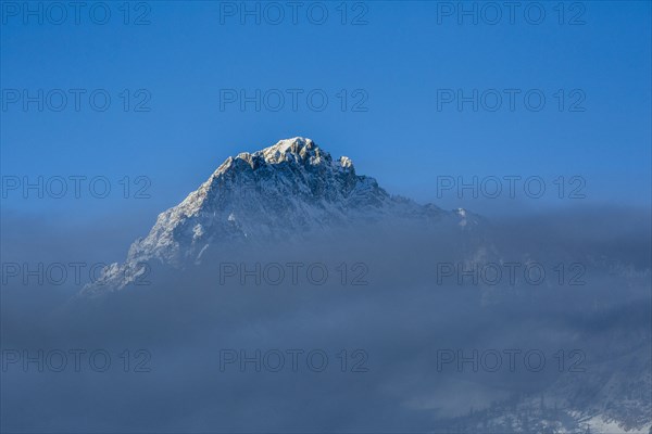 Mountain peak above clouds