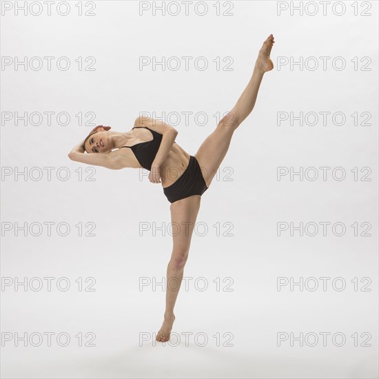 Caucasian woman ballet dancing in underwear