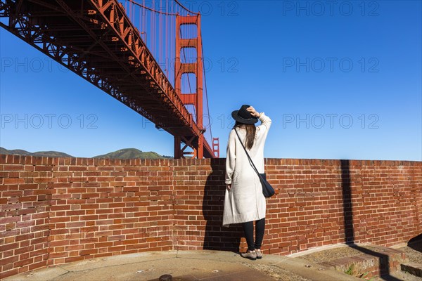 Caucasian woman admiring Golden Gate Bridge