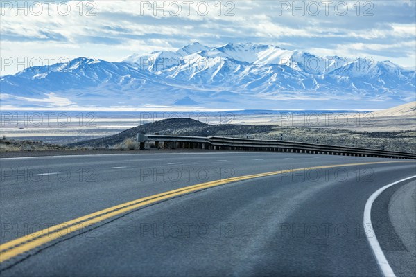 Curving street near mountain range