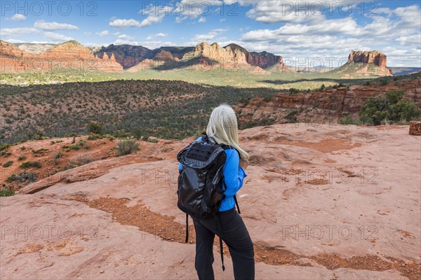 Caucasian woman hiking in desert landscape