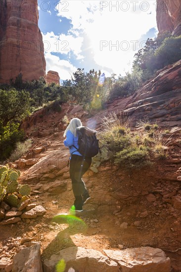 Caucasian woman hiking in desert landscape