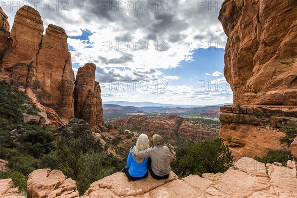 Caucasian couple admiring scenic view in desert landscape