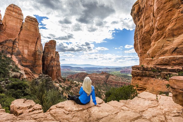 Caucasian woman admiring scenic view in desert landscape