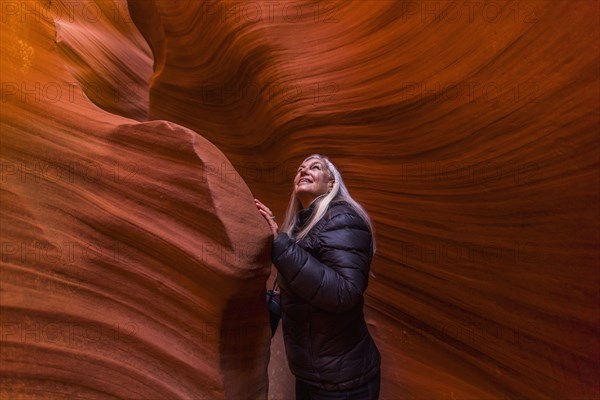 Caucasian woman standing in rock formation