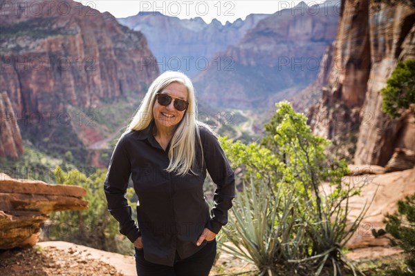 Caucasian woman posing near rock formations