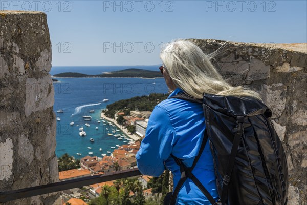 Caucasian woman admiring scenic view of ocean