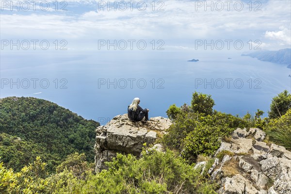 Caucasian woman admiring scenic view of ocean