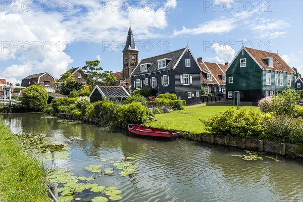 Rowboat in canal at traditional village