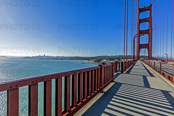 Shadows on walkway of bridge