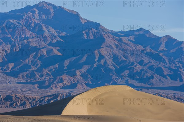 Sand dune near mountain landscape