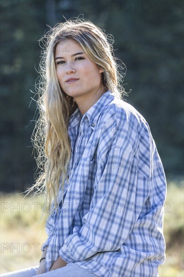 Portrait of smiling Caucasian girl wearing plaid shirt