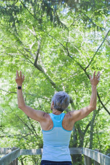 Smiling Caucasian woman celebrating outdoors