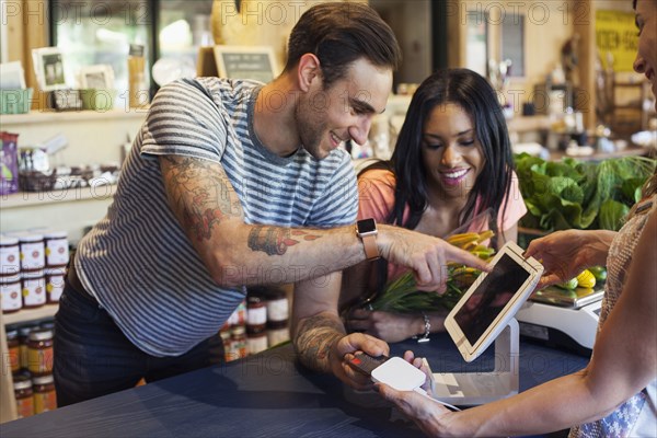 Man paying with credit card at store