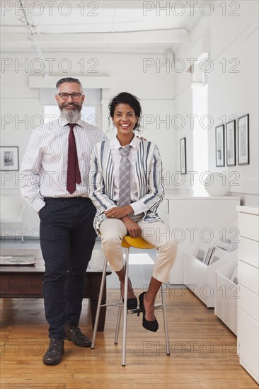 Portrait of smiling businessman and businesswoman