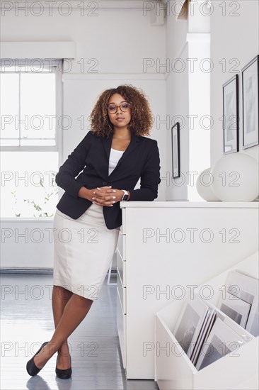 Portrait of mixed race woman in gallery