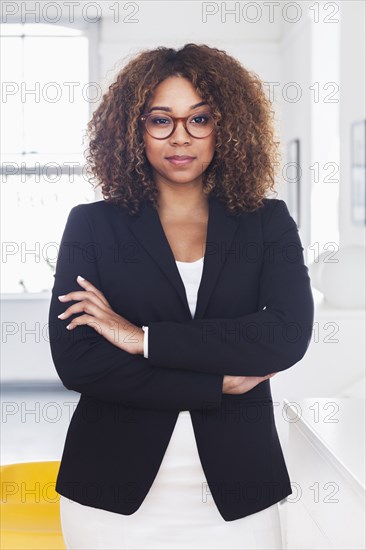 Mixed race woman posing in gallery