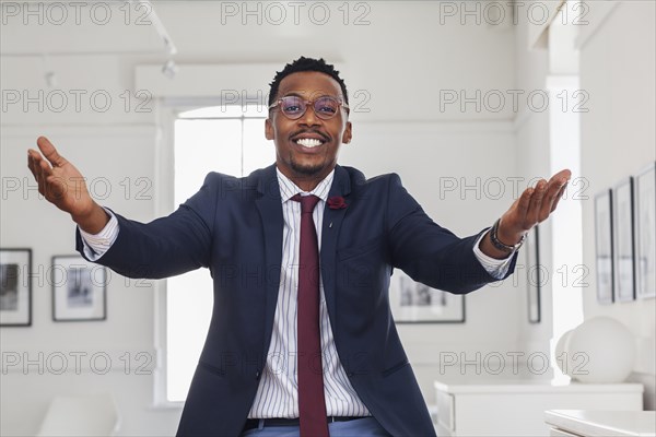 Black man gesturing in gallery