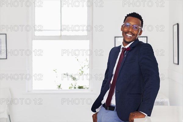 Black man smiling in gallery