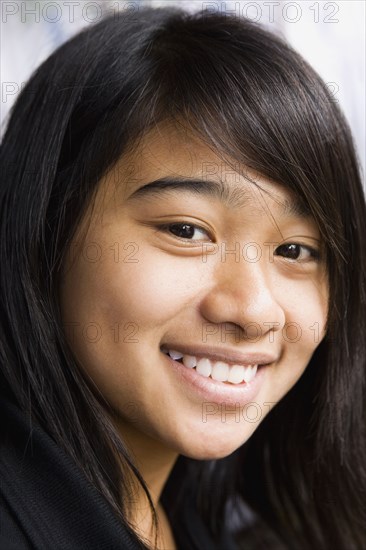 Asian teenage girl smiling