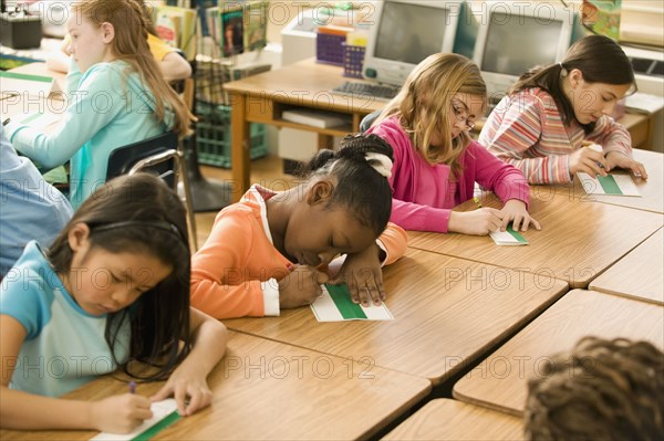 School girls making name cards