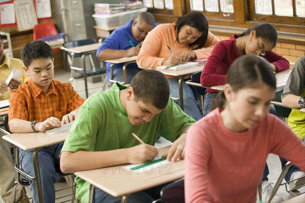 Students making name cards in classroom