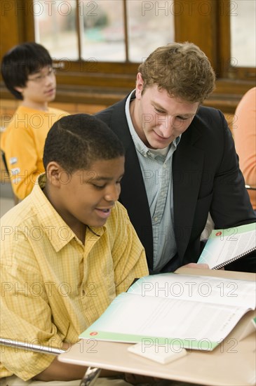 School teacher helping student