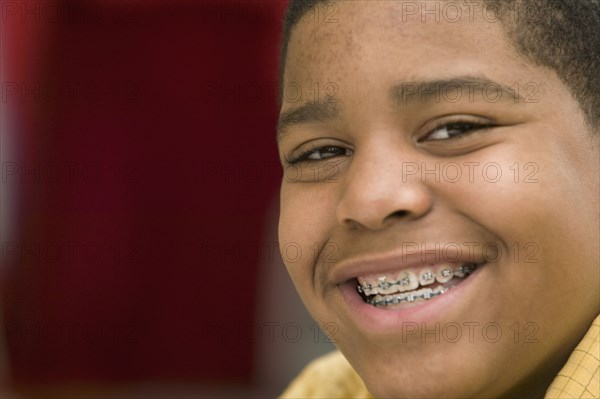 Portrait of African boy with braces