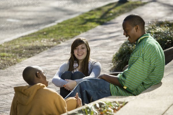 Teenage friends talking on steps