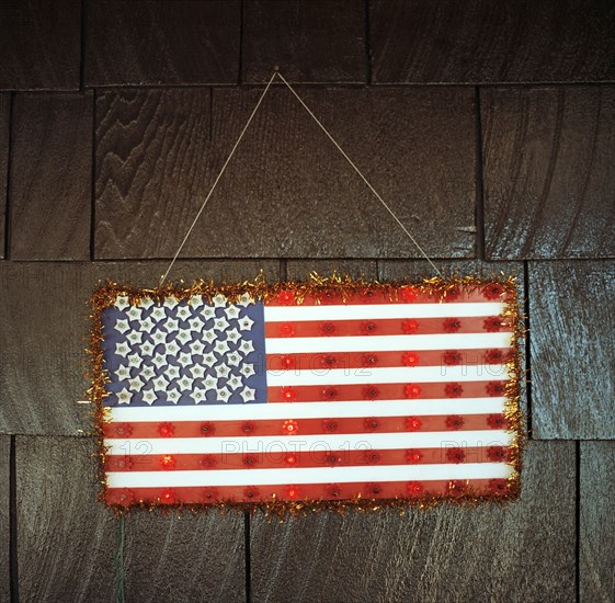 Handmade American flag hanging on wall