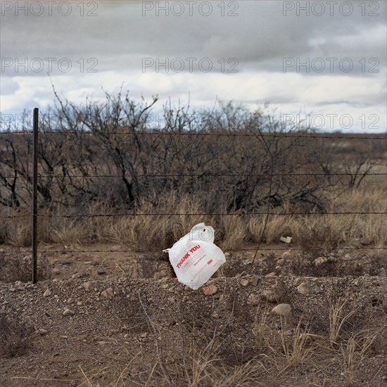 Plastic bag stuck on fence wire