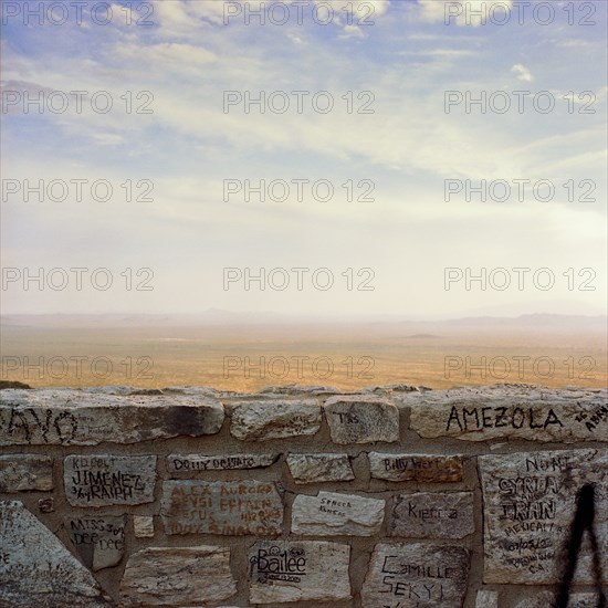 Graffiti on wall with desert in background