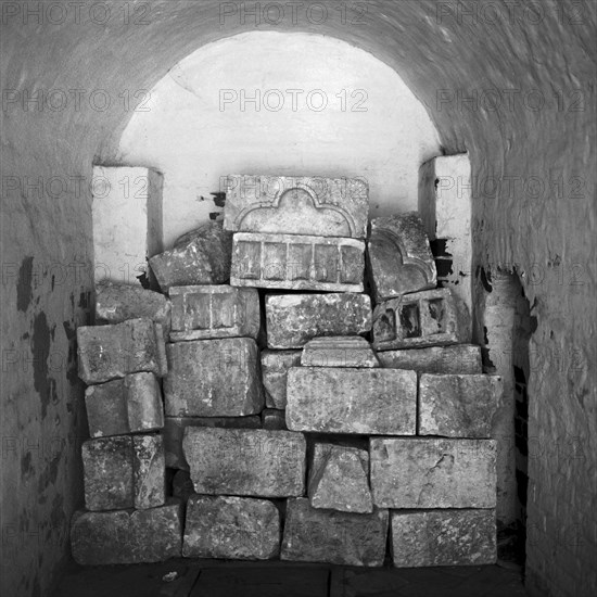 Bricks stacked in arched Russian monastery alcove