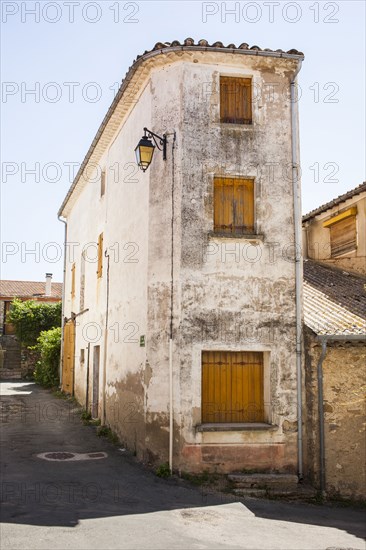 Dilapidated building on village sidewalk