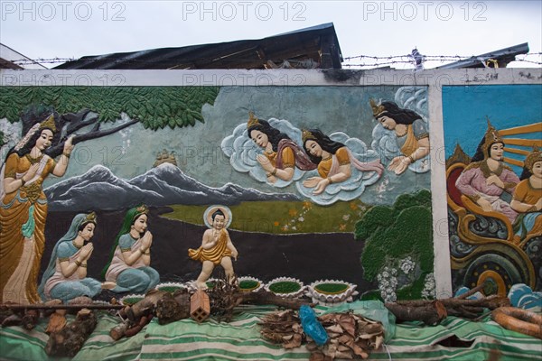 Mural of Buddhist figures painted on wall