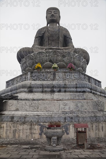 Low angle view of stone Buddha statue