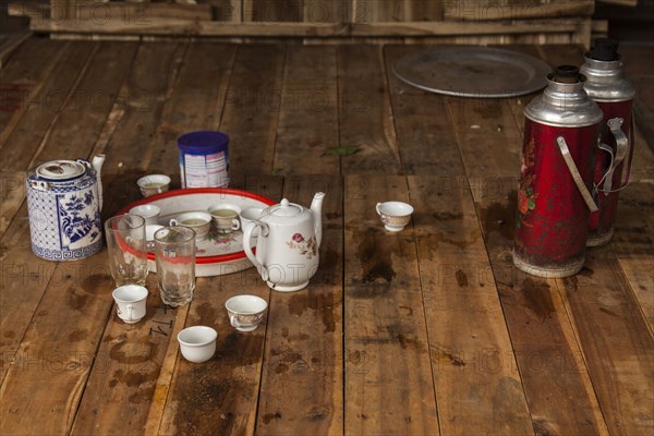 Tea place settings on wooden floor