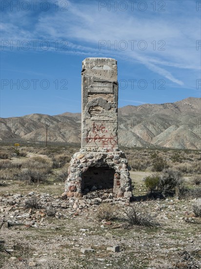Fireplace of demolished house in remote landscape